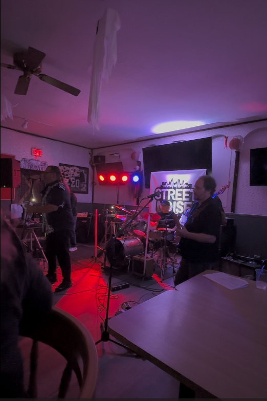 Band performing live under stage lights